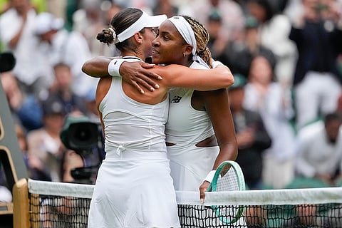 Coco Gauff embraces compatriot Caroline Dolehide